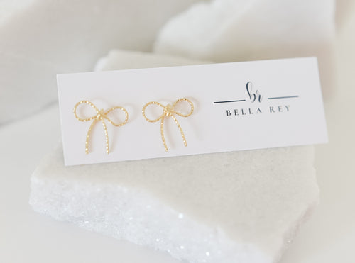 The Lala gold bow studs