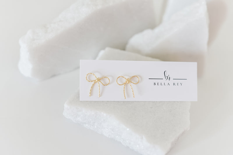 The Lala gold bow studs