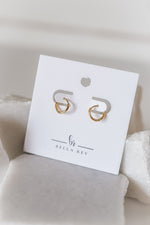 The Nia dainty huggie hoop earrings